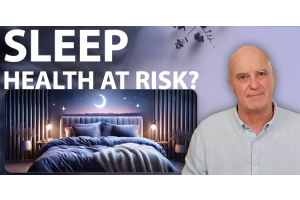 The director of Devon Duvets standing confidently with a bedroom in the background, featuring the text "Sleep Health at Risk" in bold.