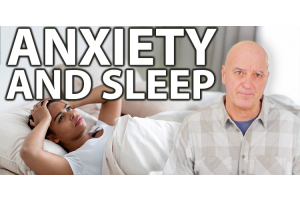 A man struggling to sleep because of anxiety. 