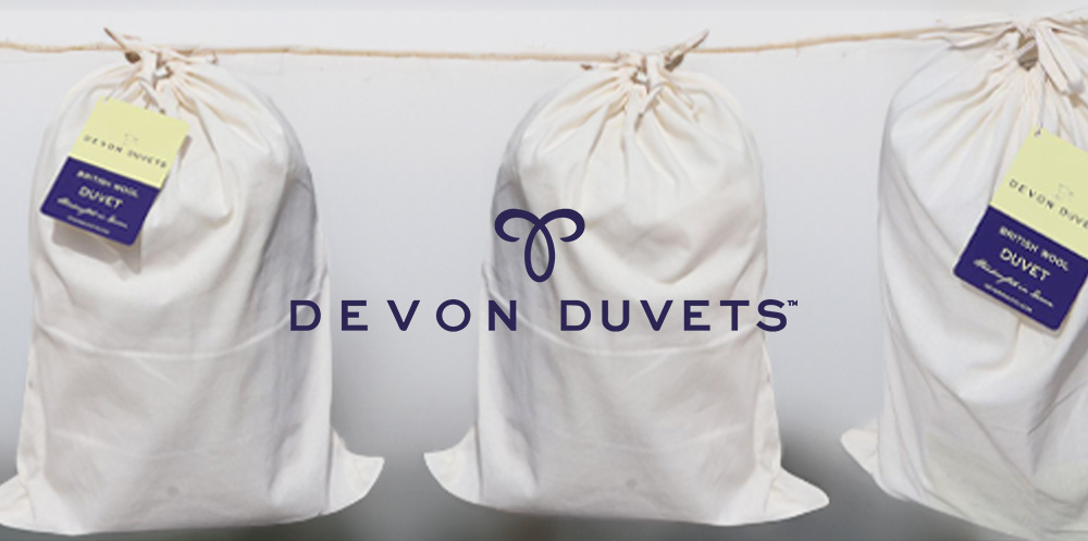 Devon Duvets bagging hanging from a closeline all handmade.