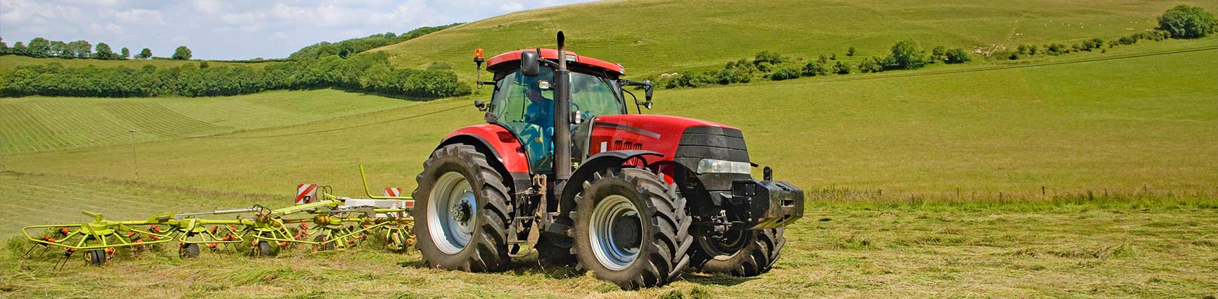 A tractor on a farm showcasing the loss of british farmers jobs.