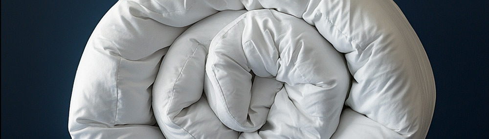 Wool duvet in a bedroom setting, illustrating breathable and hypoallergenic bedding for all seasons.